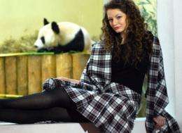A model poses wearing a tartan designed in the honour of the two giant panda's recently acquired by Edinburgh Zoo