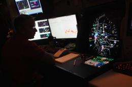 An air traffic controller monitors flights