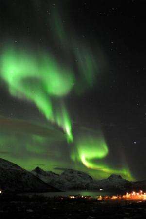 An Aurora borealis is pictured near the city of Tromsoe, northern Norway