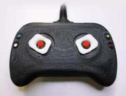 A new direction for game controllers: Prototypes tug at thumb tips to enhance video gaming