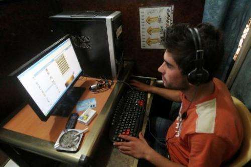 An Iraqi man uses a computer at an Internet cafe in Baghdad