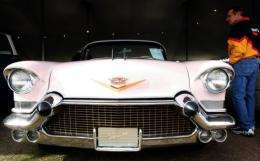 A pink Cadillac like that seized from Kim Dotcom, along with a Rolls Royce Phantom