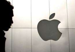 Apple on Tuesday reported a record $13.06 billion net profit for the first quarter of fiscal 2012