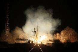 A Russian Soyuz-U booster blasts off a launch pad at the Russian leased Kazakhstan's Baikonur cosmodrome