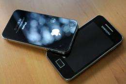 A Samsung phone (R) and an Apple iPhone 4.