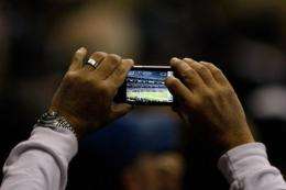 A survey shows that 60% of mobile owners will check or use their devices during the Super Bowl