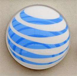 AT&amp;amp;T posts 4Q loss on charges; revenue increases (AP)