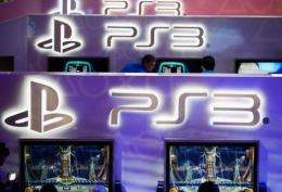 Attendees play new video games at the Sony Playstation booth during the E3 gaming conference in Los Angeles