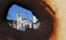 A view of the main square "Marijin Dvor" in the Bosnian capital Sarajevo, is seen through a 20 year old shrapnel hole