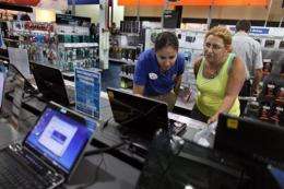 A woman shops for a computer at a Best Buy store in 2009 in Miami, Florida