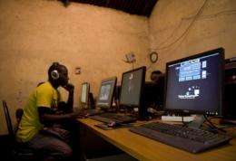 A young man sits at a cyber cafe in Kenya in June