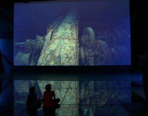 Children look at images of the Titanic wreck on the seabed at the Titanic Belfast visitor centre