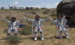 Chinese astronauts parachute land after mission