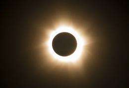 Clouds part, solar eclipse darkens north Australia