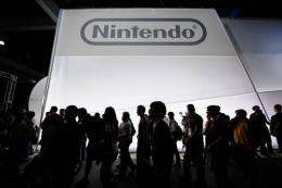 Crowds line up to view the new Nintendo game console Wii U in 2011