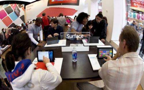 Customers get a look at tablets at Microsoft's pop-up store in New York