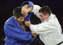 David Douillet of France fights against Shinichi Shinohara of Japan in his gold medal victory