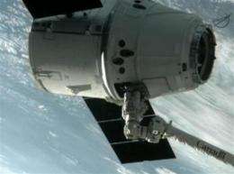 Dragon makes history with space station docking (AP)