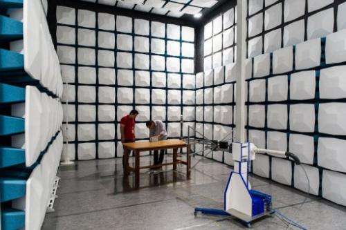 Engineers test an electromagnetic wave inside the anti-echo chamber at Eldorado research institute in Campinas, Brazil