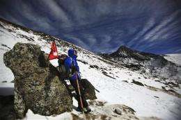 Everest hero highlights flood threat in Himalayas (AP)