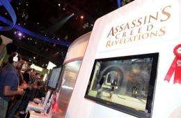 Gamers play Ubisoft's video game "Assassin's Creed" in 2011
