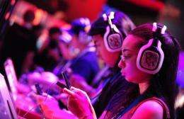 Gaming fans sample new titles and devices at the E3 videogame extravaganza in Los Angeles