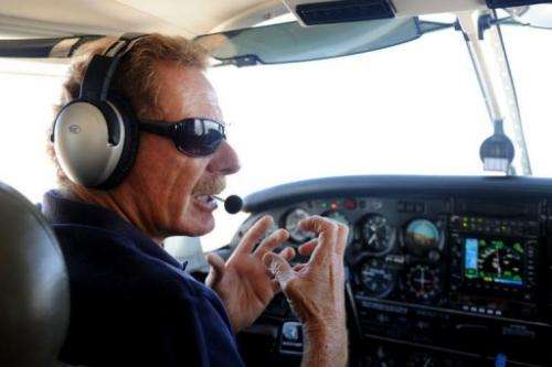 Gerard Moss talks as he flies the small plane he uses for his "Rios Voadores" (Flying Rivers) project