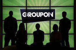 Groupon reports smaller 1Q loss, higher revenue (AP)