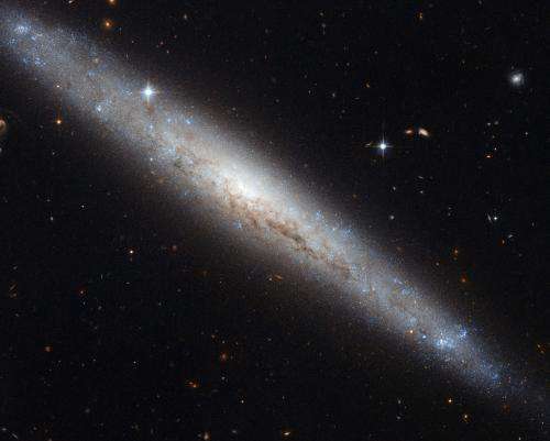Hubble Portrays a Dusty Spiral Galaxy