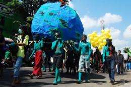 Indonesian environmental activists parade during a protest to mark Earth Day