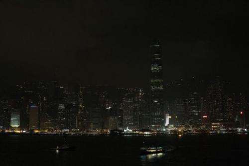 In Hong Kong the city's skyscrapers turned out their lights dimming the usually glittering skyline