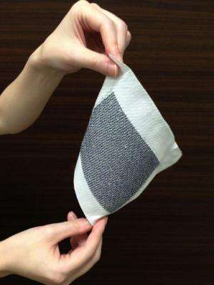 Japanese researchers say their solar-cell fabric would eventually let wearers harvest energy on the go