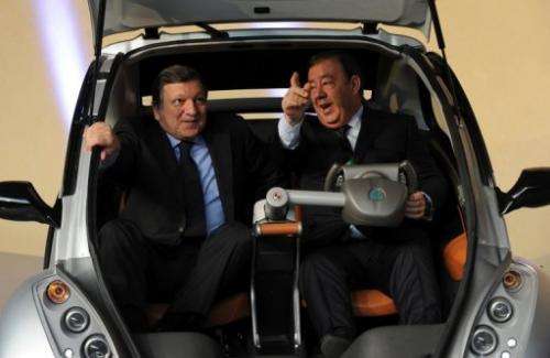 Jose Manuel Barroso (left) helps launch the Hiriko fold-up car in Brussels today