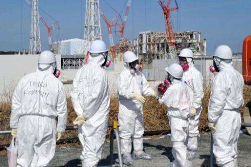 Journalists in protective clothing visit the stricken Fukushima nuclear power plant this week