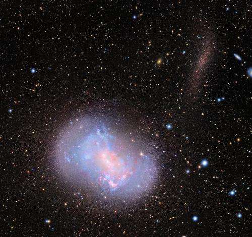 New images capture 'stealth merger' of dwarf galaxies