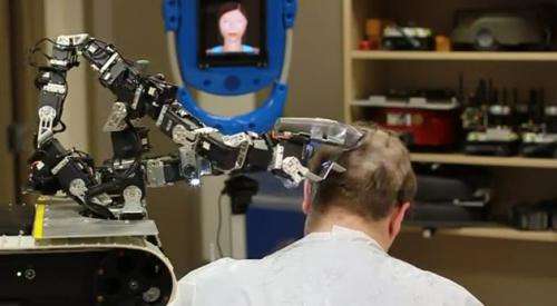 IAI’s military robot acts like barber in charity role