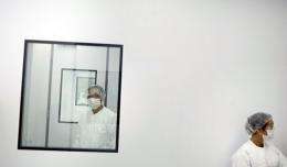 Lab workers are seen in a scientific research center