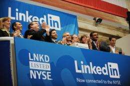 Linkedin founder Reid Garrett Hoffman (C) and CEO Jeff Weiner (2nd R) at the ringing of the opening bell of the NYSE
