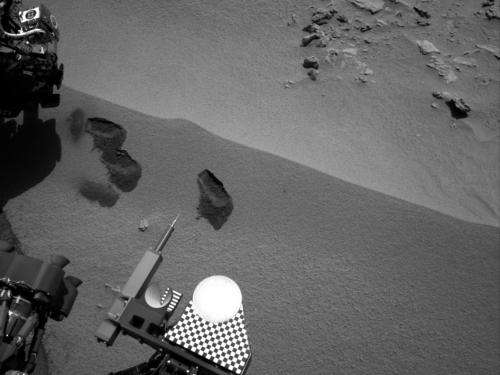 Mars soil sample delivered for analysis inside rover