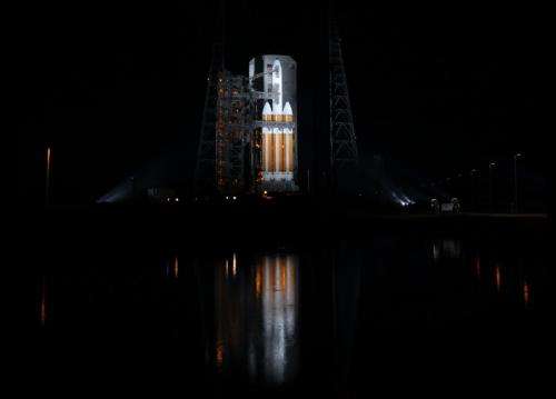 Mighty Delta 4 heavy rocket and Clandestine satellite poised at pad