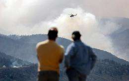 More firefighters have been called up to help fight a raging wildfire in the western US state of Colorado