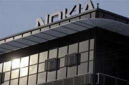 Nokia lowers profit outlook, shares nosedive (AP)