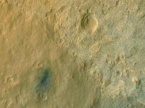 Orbiter views Curiosity Mars rover in color