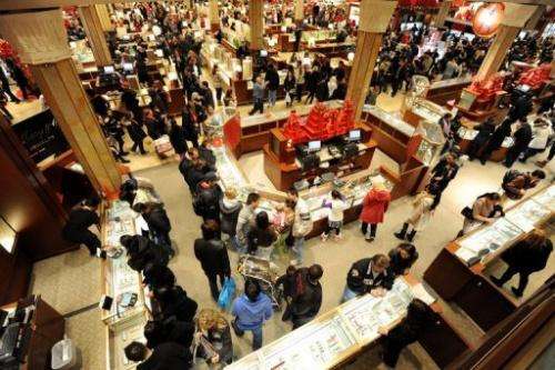 People crowd the aisles inside a Macy's department store after the midnight opening on "Black Friday" in 2011