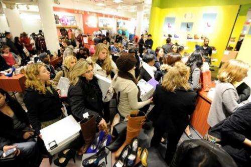 People stand in line to make purchases inside Macy's department store on Black Friday in 2011