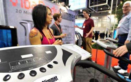 People try out the VibaBody Slimmer exercise machine