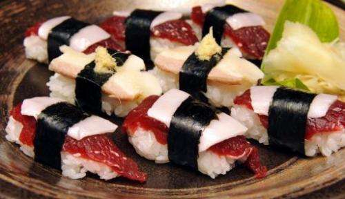 Pieces of whale sushi, made from sliced minke meats, blubber and rice balls, are seen in Ayukawahama, on June 16, 2010