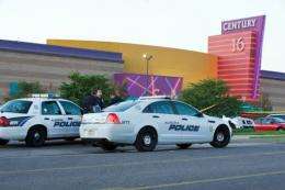 Police cars in front of the Century 16 theater in Aurora, Colorado where a gunman opened fire