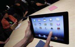 Report: Tablets helping improve news consumption (AP)