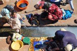 Residents of Imiter, Morocco, wash clothes at the village wash-house